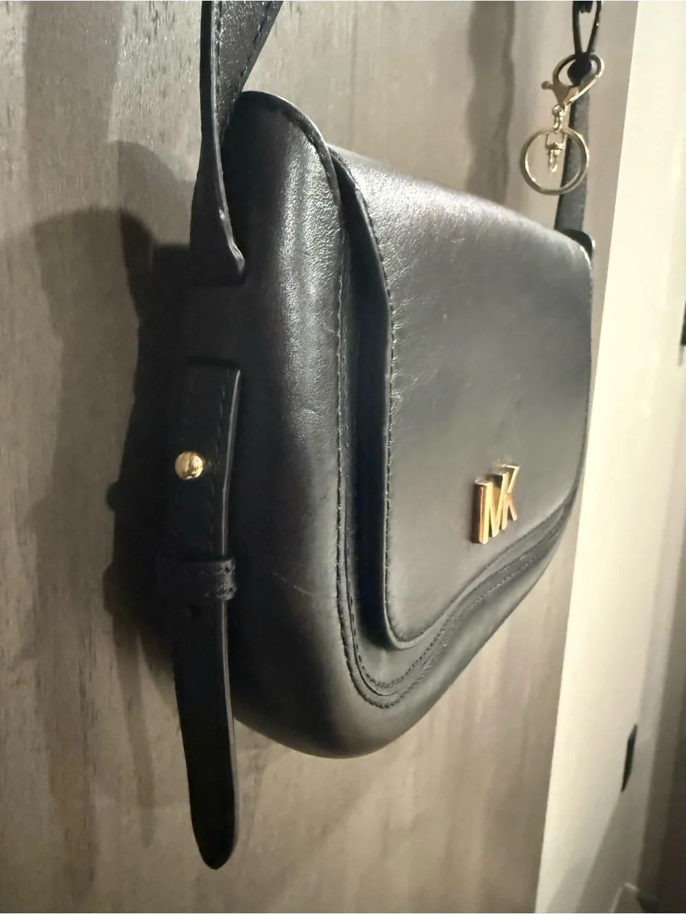 ⁠MICHAEL KORS Jolene black leather saddle bag with interlocking woven strap